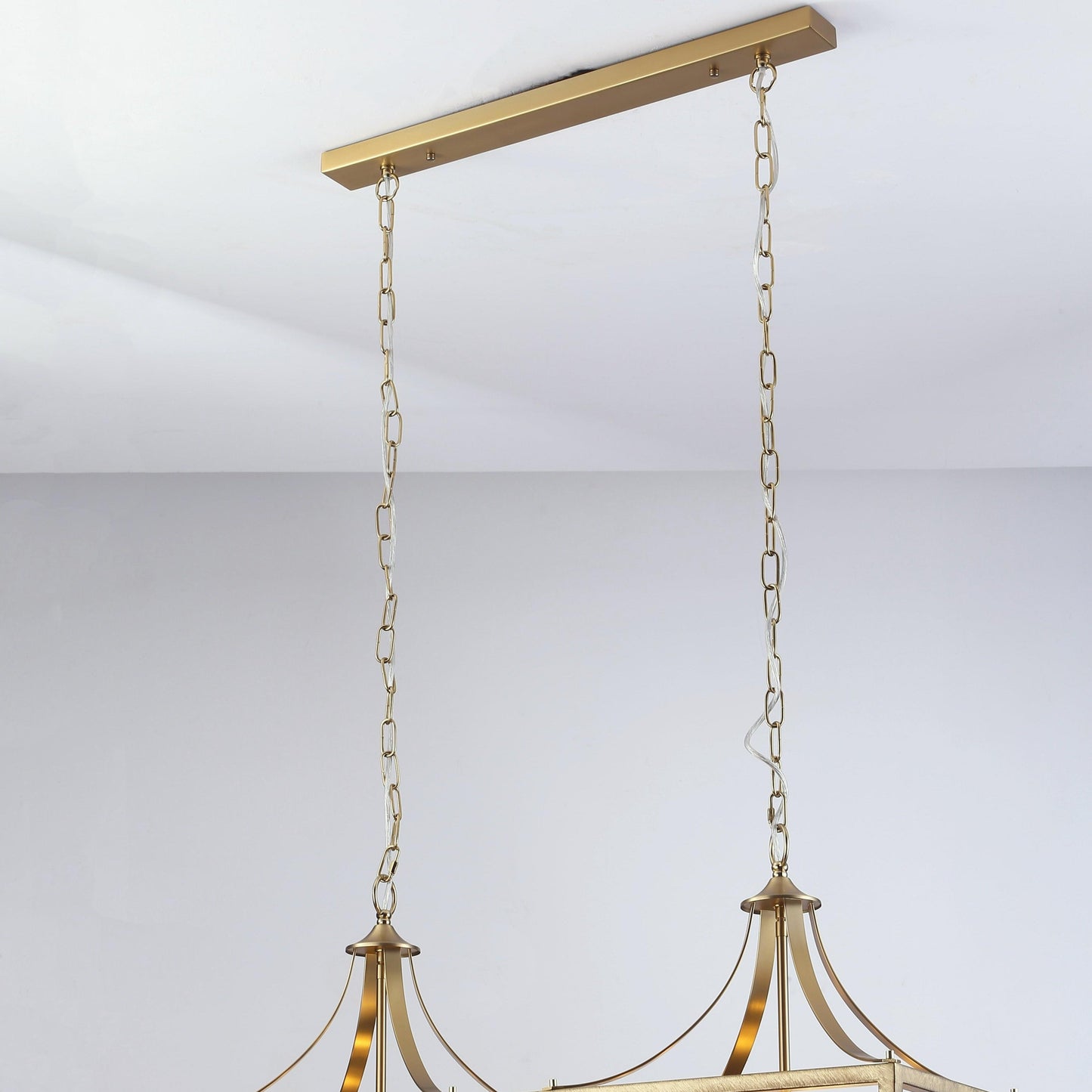 Brushed gold pendant light with chain suspension and arched frame detail