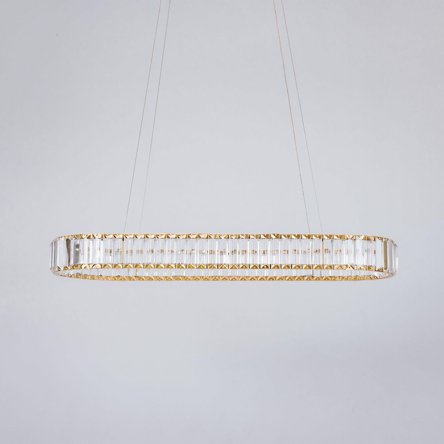 Oval crystal LED chandelier with gold hardware and clear glass crystal surround