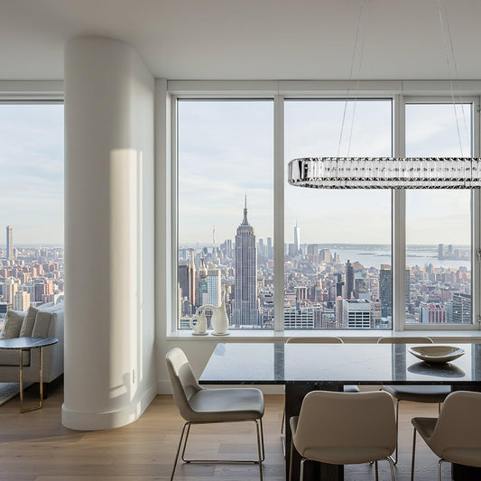 Oval crystal LED chandelier with black hardware, suspended over ceiling