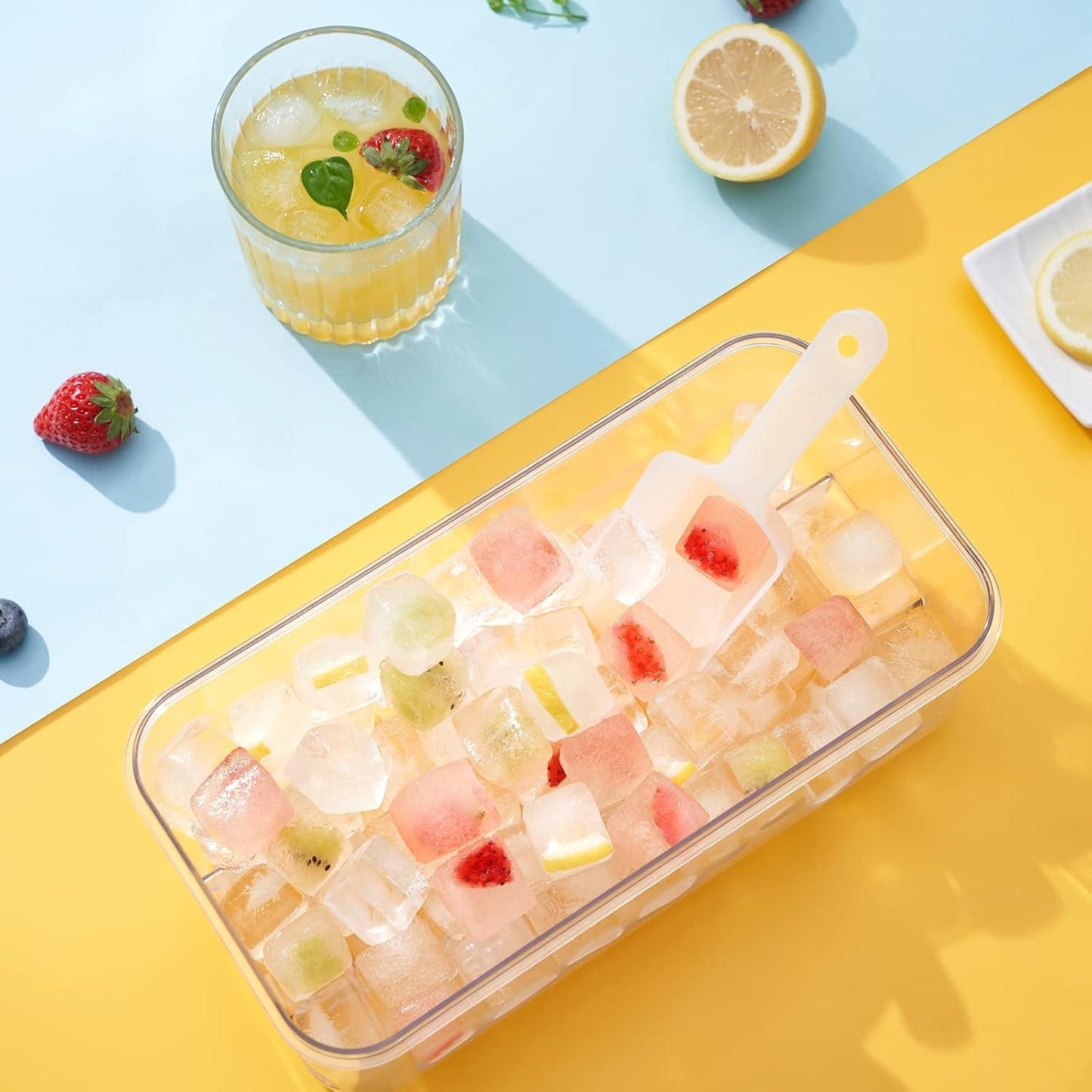 Rectangular ice cube tray filled with fruit ice cubes in clear mold