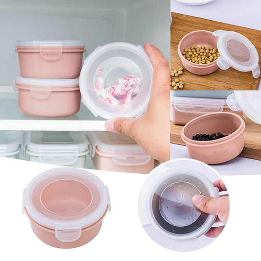 Set of small pink plastic lunch storage boxes with clear lids