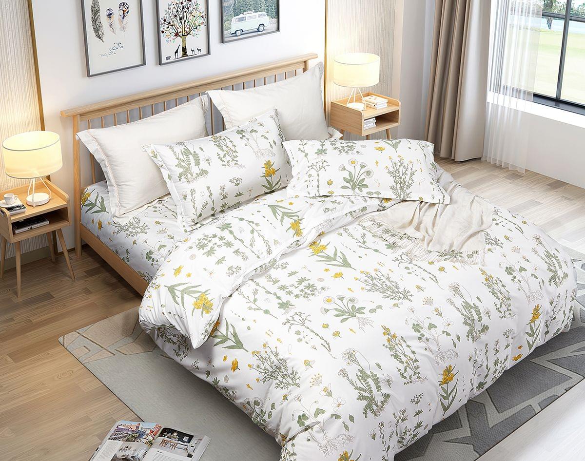 Duvet quilt cover set with white botanical print, green leaves and small yellow blooms