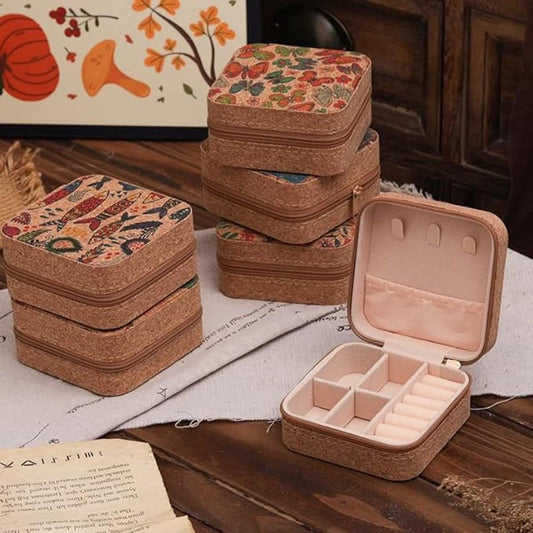 Stacked vintage jewelry boxes with floral lids, open hinged box with pale interior