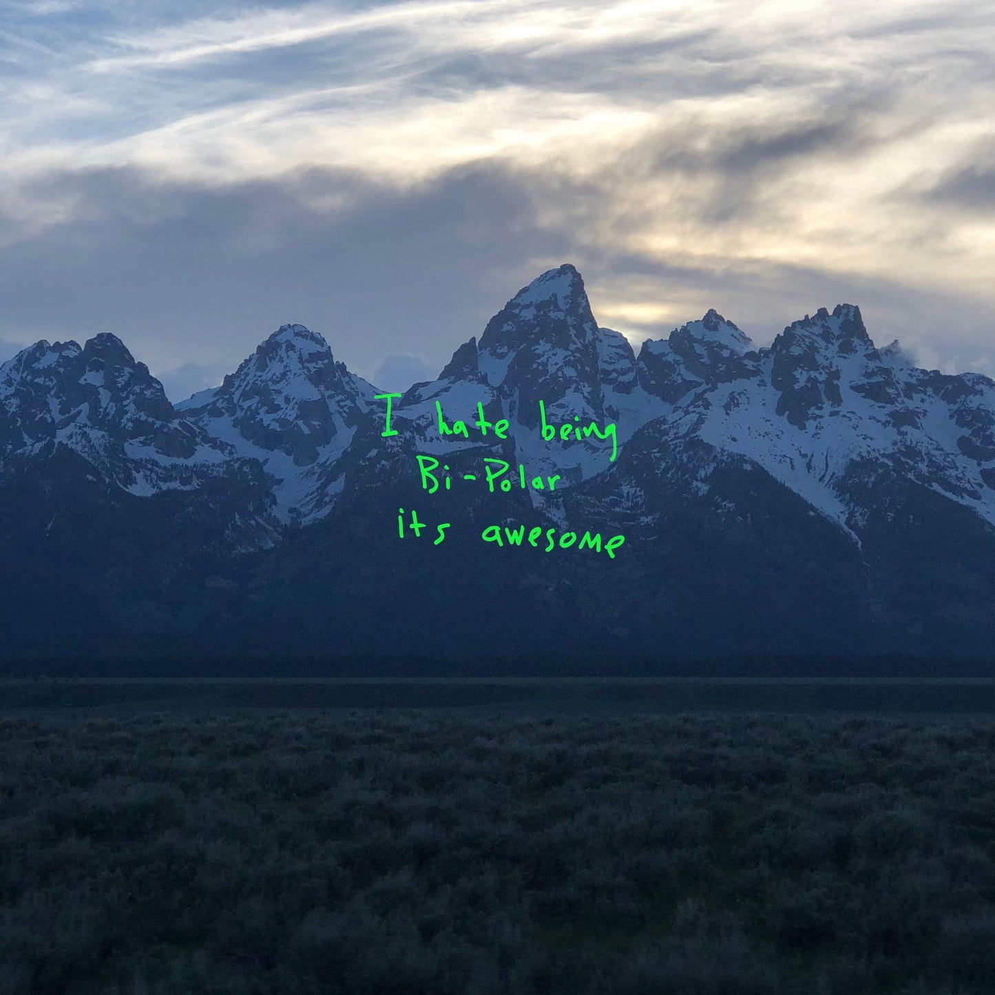 Vinyl album cover with mountain landscape and green handwritten text
