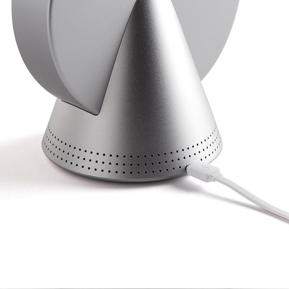 Conic radio alarm clock speaker base with perforations and white power cable