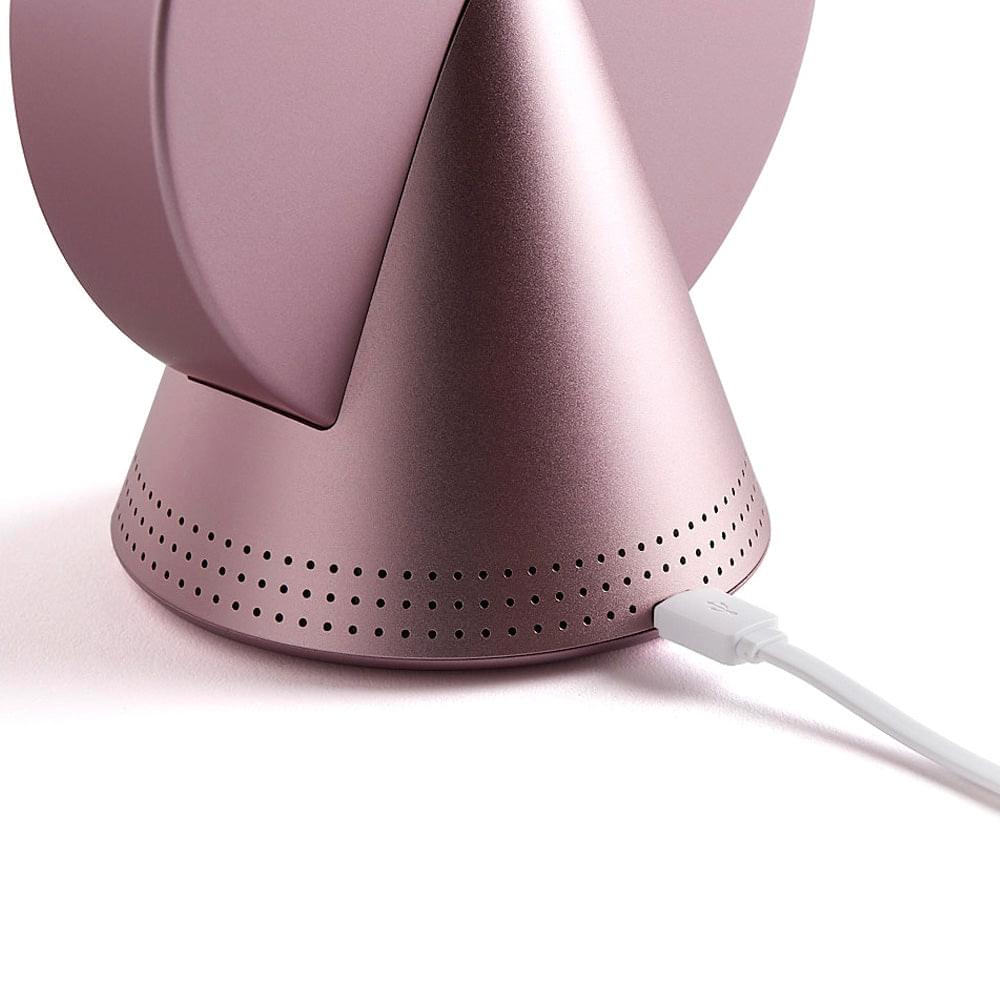 Pink conic radio alarm clock base with speaker grille and USB power cable