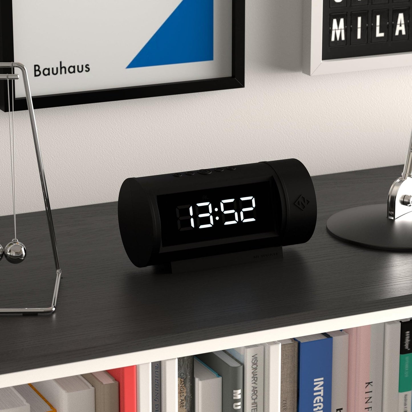 Black LED alarm clock, front view on desk with glowing LED time digits.