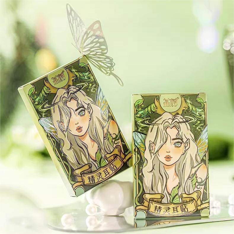 Elf ear sticker boxes with elf-girl artwork, two boxes with pearls
