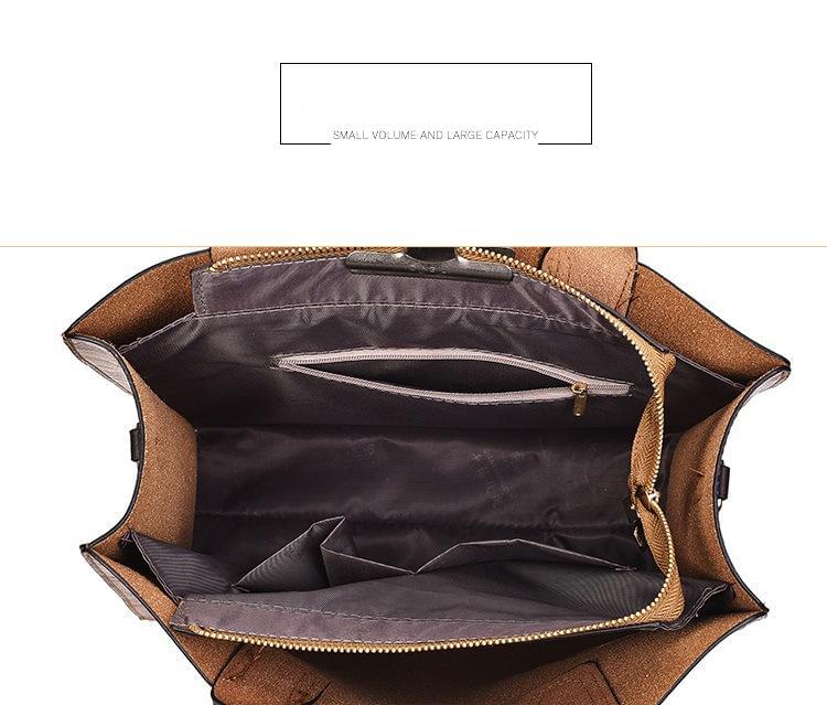 Open tan leather tote interior with zip pocket and slip compartments.