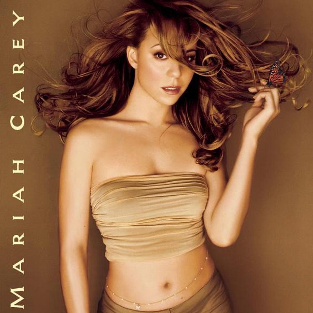 Album cover art with a woman in a strapless gold top and curly hair
