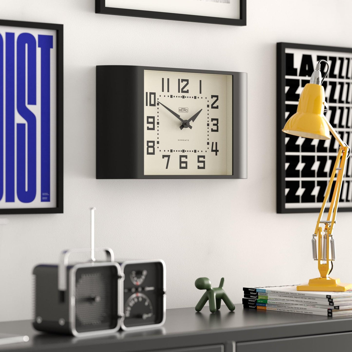 Black rectangular wall clock with cream dial, large numerals 1–12, black hands