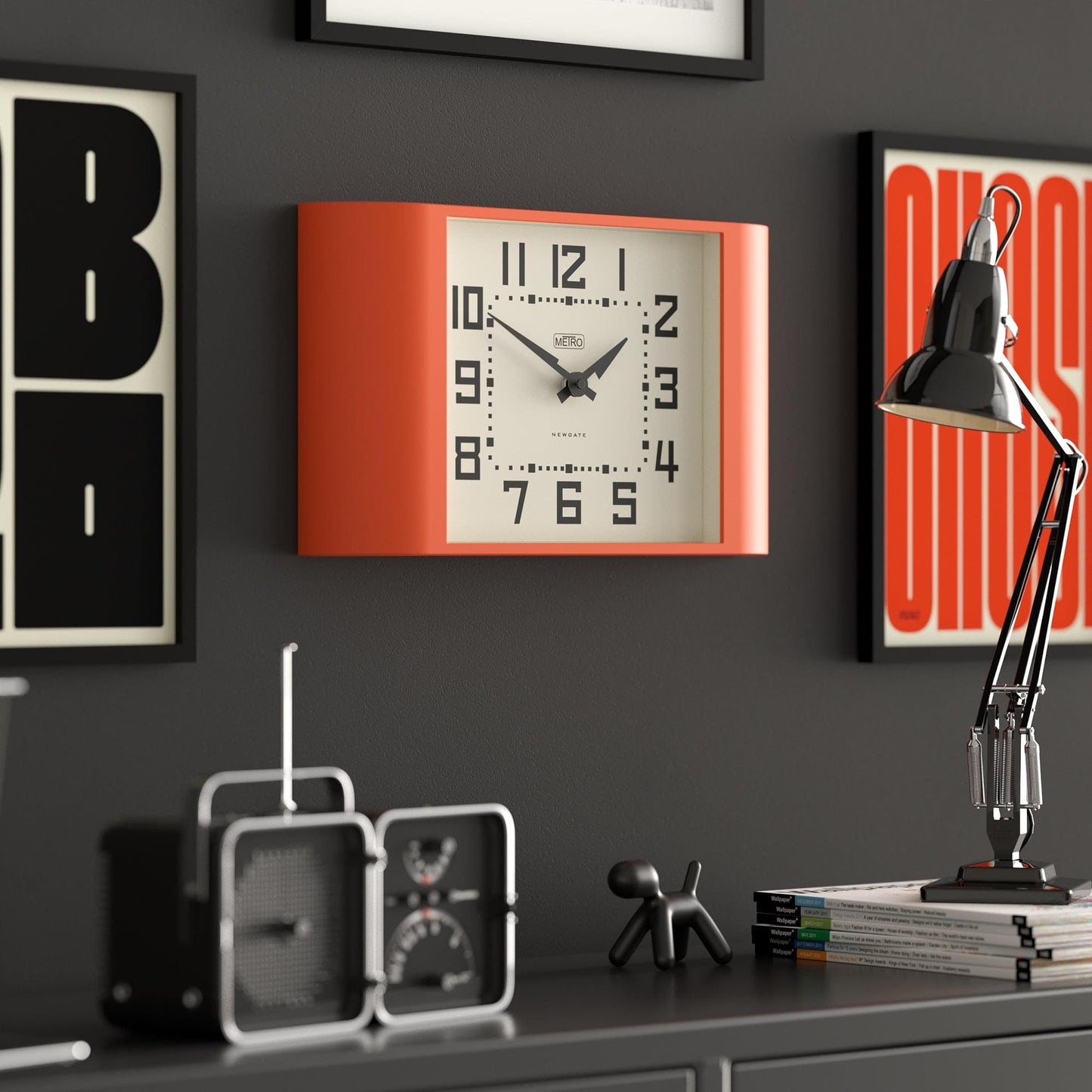 Pumpkin orange rectangular wall clock with white dial, black minute marks, and analog hands