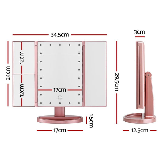 Pink tri-fold makeup mirror with LED-lit center panel, hinged side doors, and stand