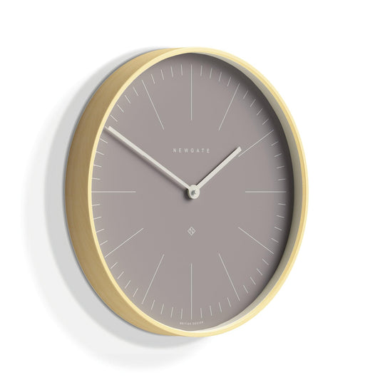 Newgate wall clock, angled view with pale wood bezel and grey dial, minute ticks around edge.