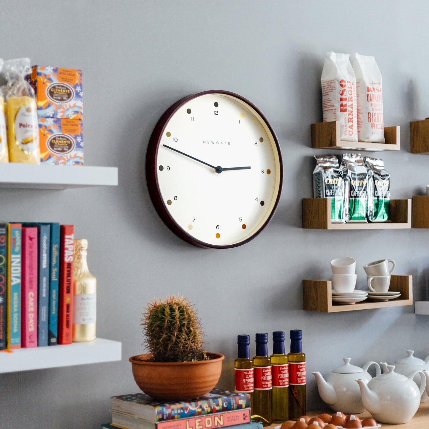 Cream dot dial wall clock with dark wood frame and colored hour dots