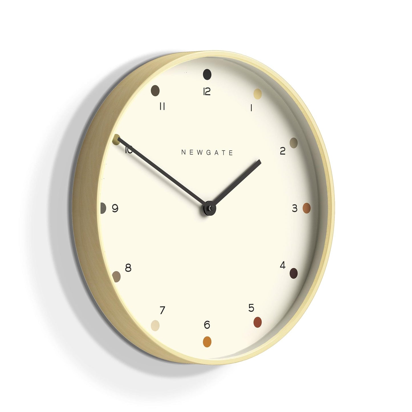 Oval pale wood wall clock with cream dot dial, black hour and minute hands