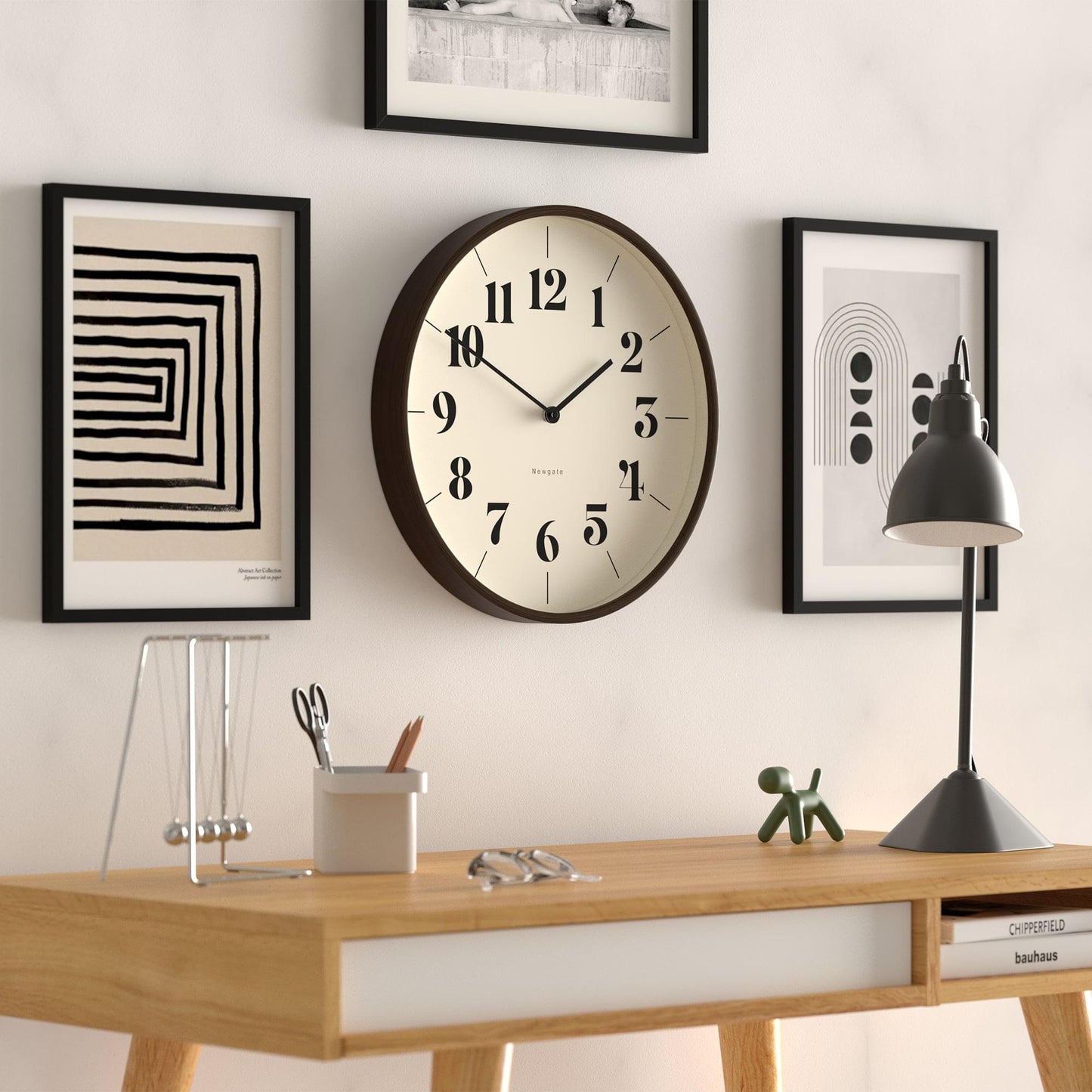Round wall clock with dark wood border and cream hopscotch dial, black hour markers