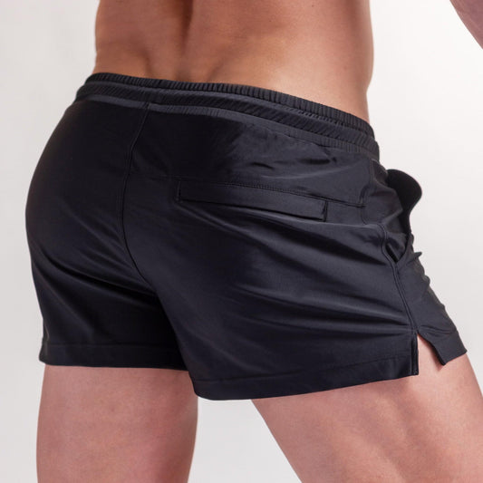 Midnight black 3" swim shorts with side flap pocket and relaxed fit