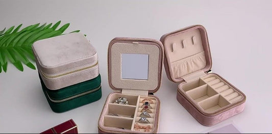 Small jewelry box set with zipper, green and pink cases open with compartments