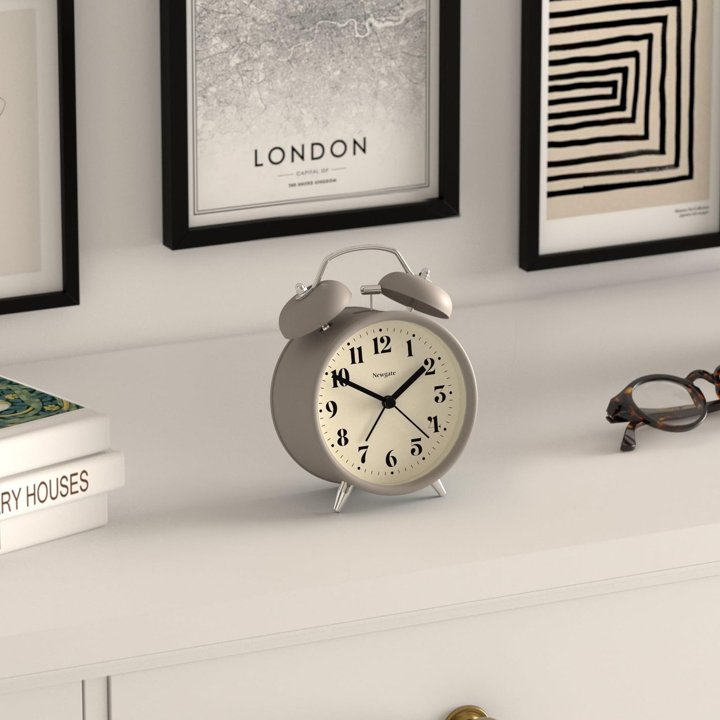 Stone gray twin-bell alarm clock with white dial and black hour hands