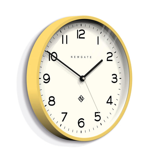 Yellow wall clock with black Arabic numerals, Newgate logo, and minute markers
