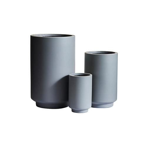 Light gray cylindrical planter set with three pots, stacked sizes and round open tops.