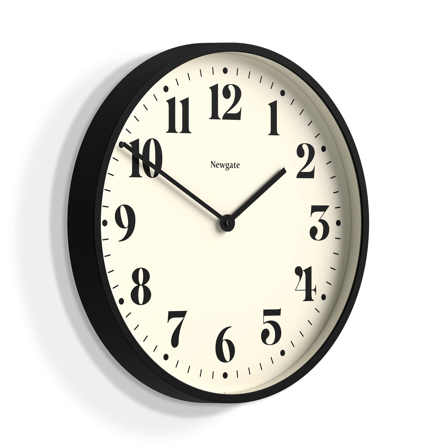 Matte black wall clock, cream dial with Roman numerals and black hands; Newgate