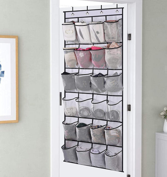 Over-the-door shoe organizer with hanging straps and mesh pockets on a door