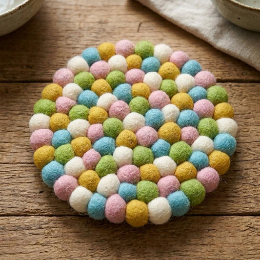 Round pastel confetti wool felt heat mat with multicolor pom-pom border