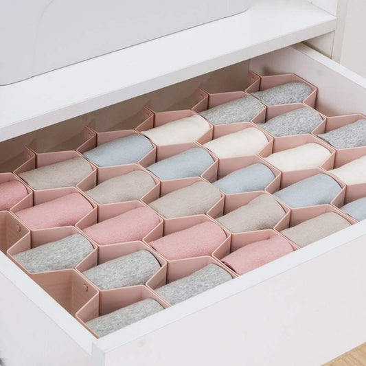 Pink drawer divider organizer with hex compartments for folded socks