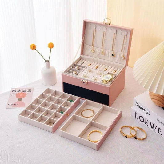 Lockable jewellery box with lid open, multi-compartment trays for bracelets, rings, and necklaces