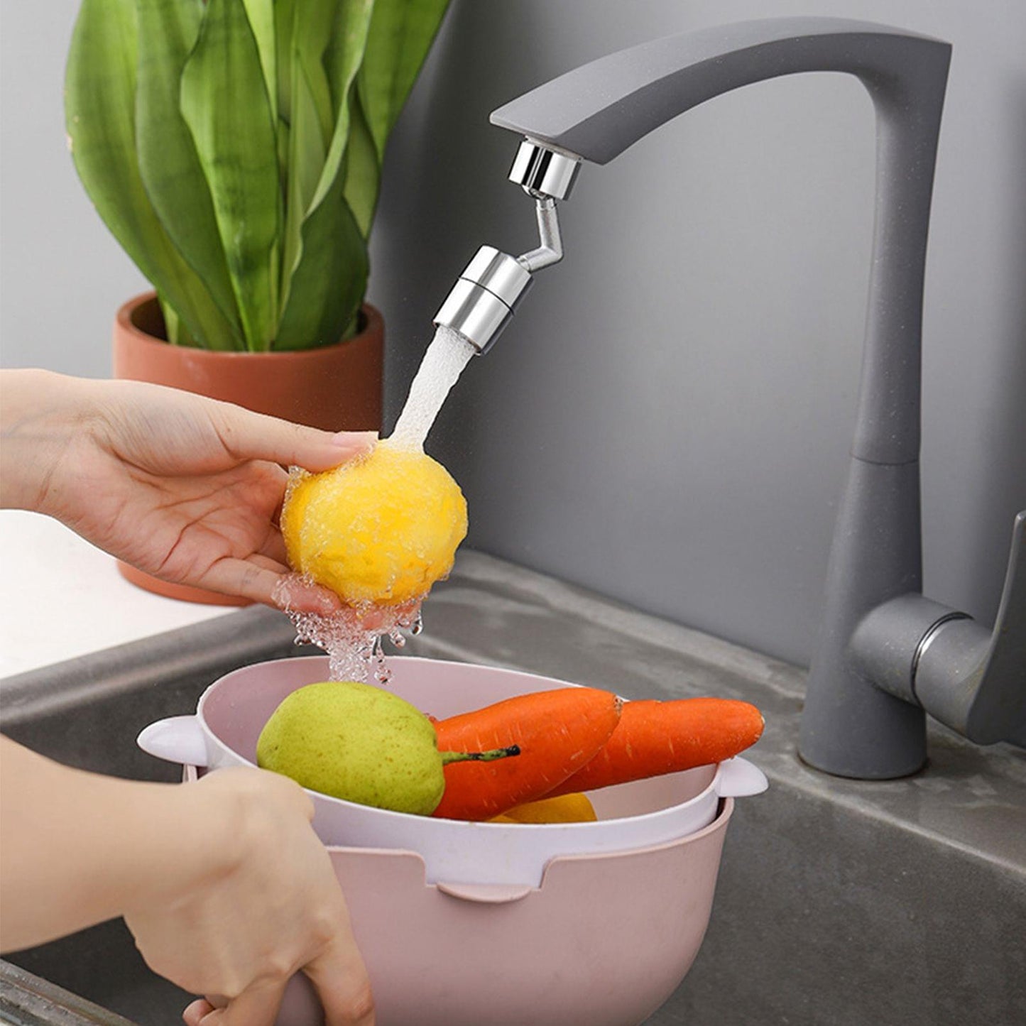 Faucet aerator extender rinsing produce under a focused spray stream