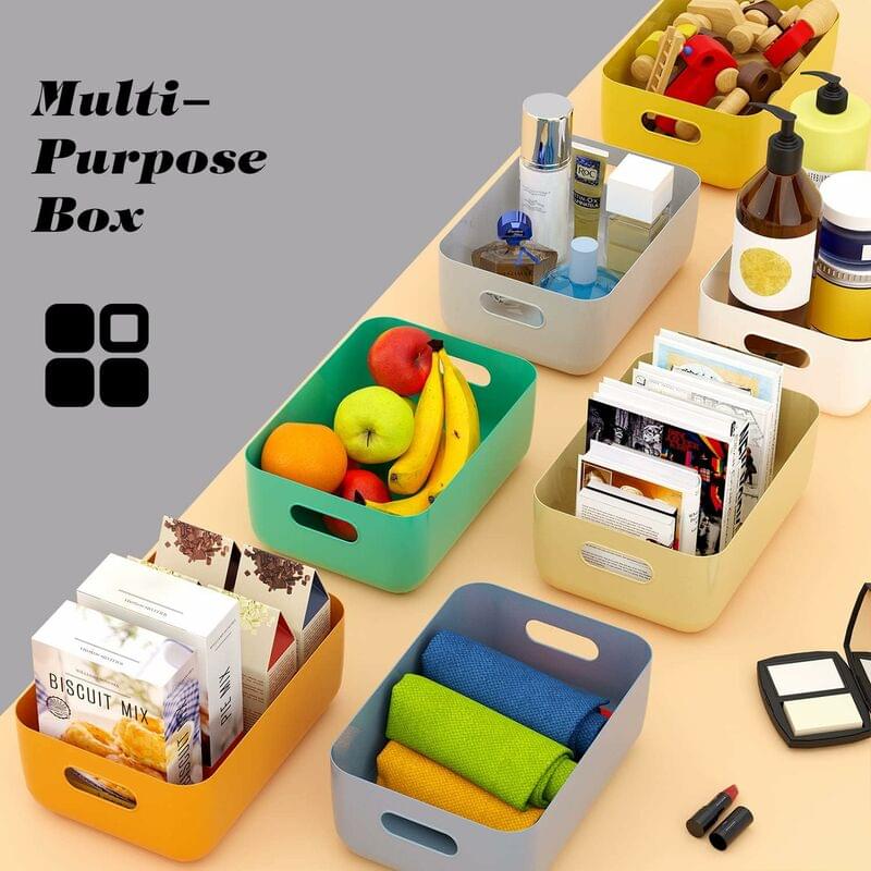 Colorful plastic storage baskets with handles, filled with small items and supplies
