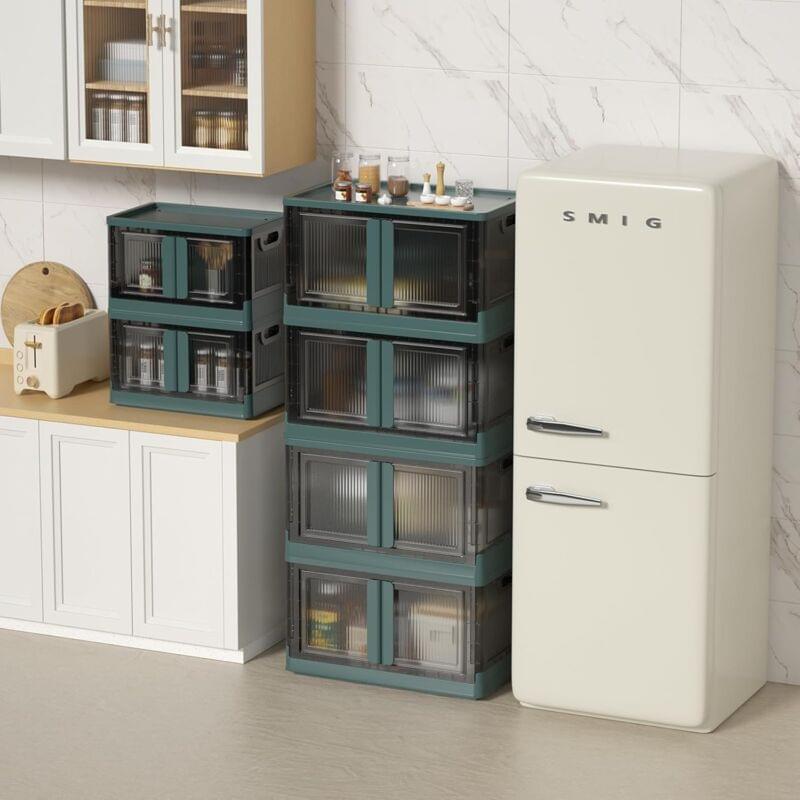 Stack of green-lidded clear plastic storage boxes with latches for kitchen storage