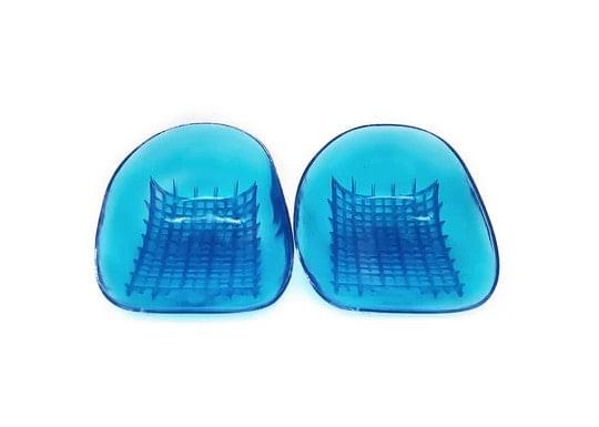 Pair of blue gel heel cups, domed shape with grid pattern on the base.