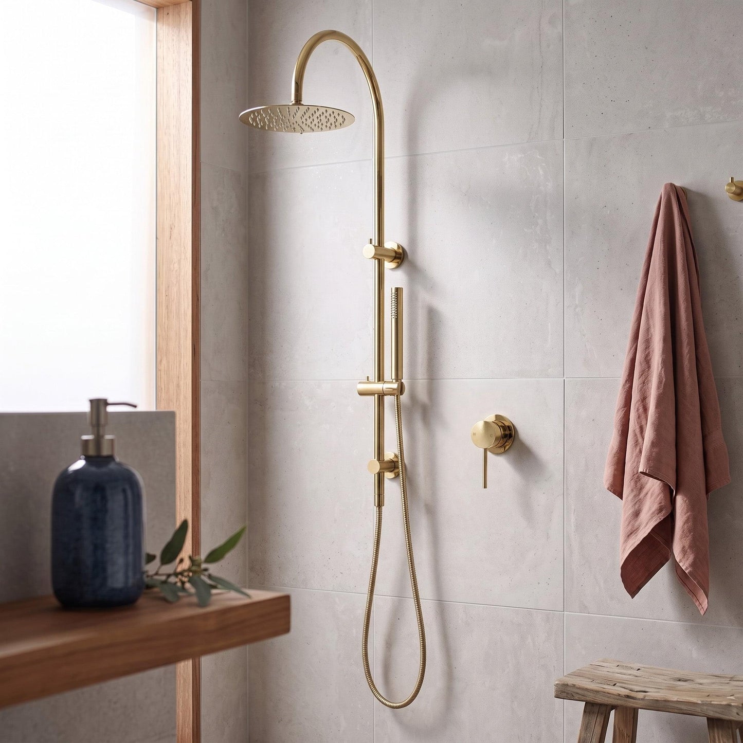 Polished gold shower mixer with rain shower head and wall-mounted controls