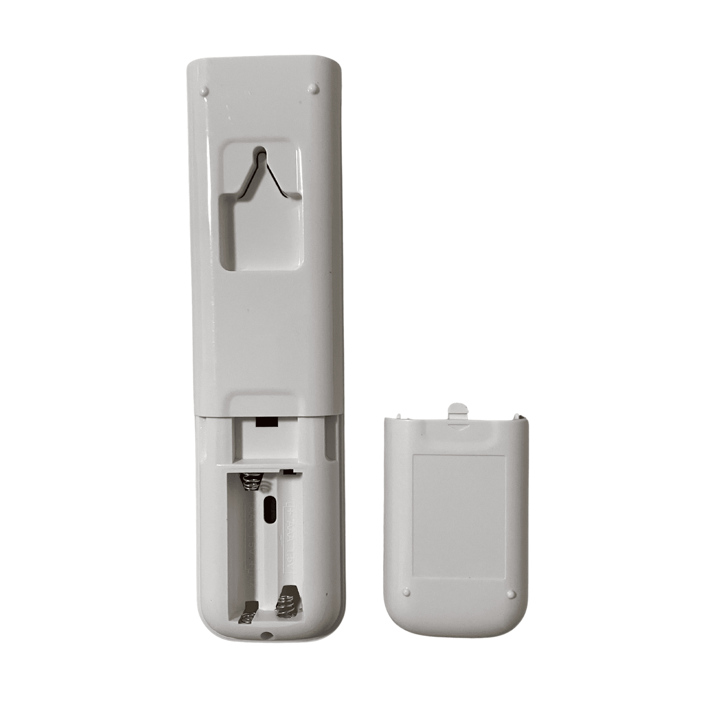 White air conditioner remote control with back cover removed, battery compartment visible