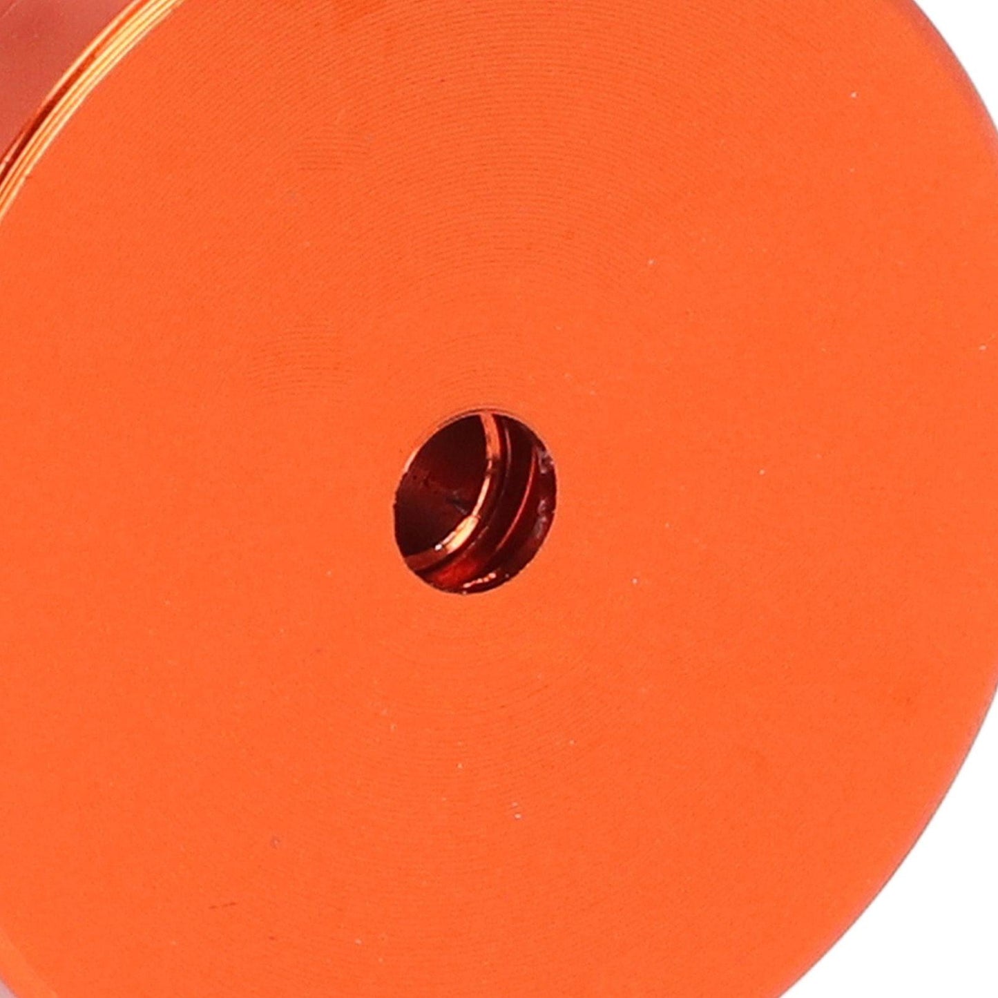 Aluminum towel hook mounting hole on orange base with visible screw opening