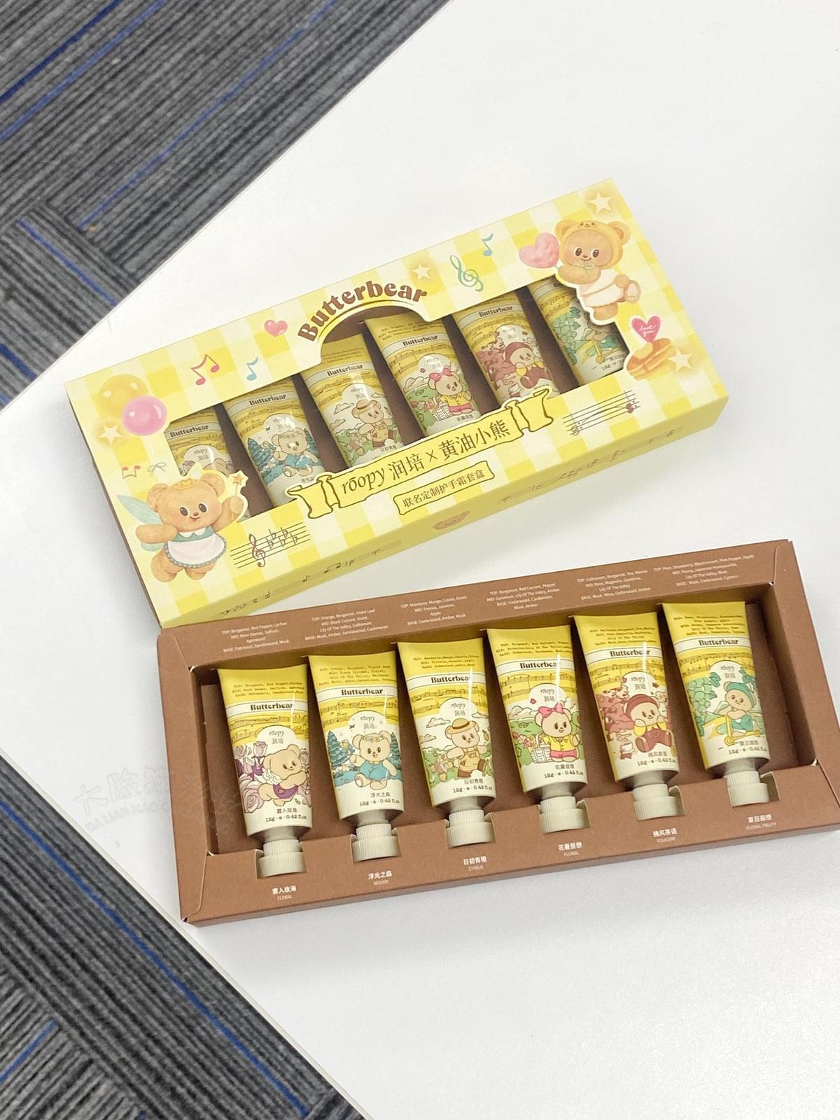 Mini hand cream set with six small tubes in a decorated box, top view