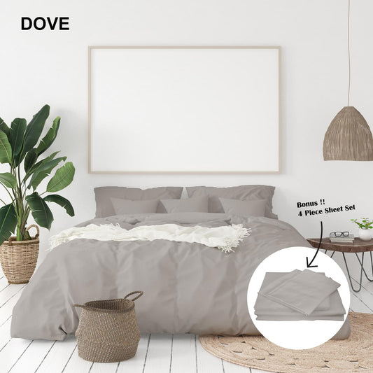King duvet cover and pillowcases in dove gray, set laid out on bed