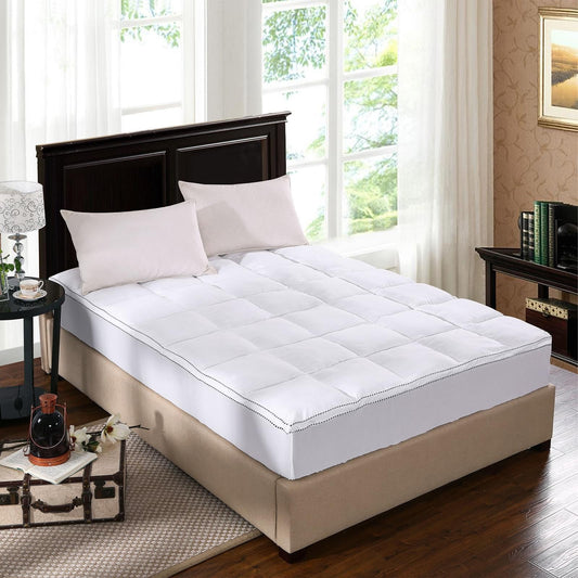 White king mattress pad topper cover on bed with corner piping