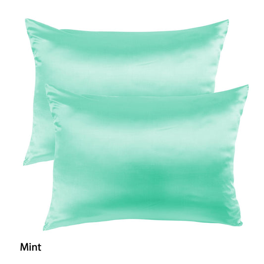 Two mint satin silk pillowcases with smooth surface and visible front seams