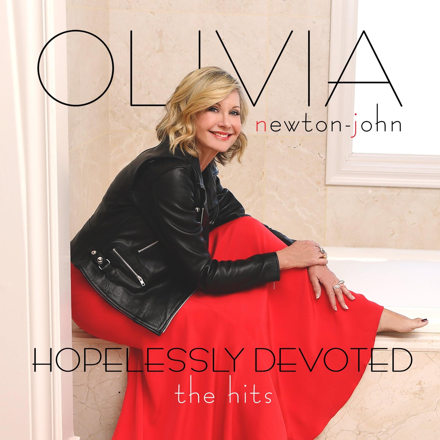 CD album cover: blonde woman in black jacket and red dress; 'Hopelessly Devoted'