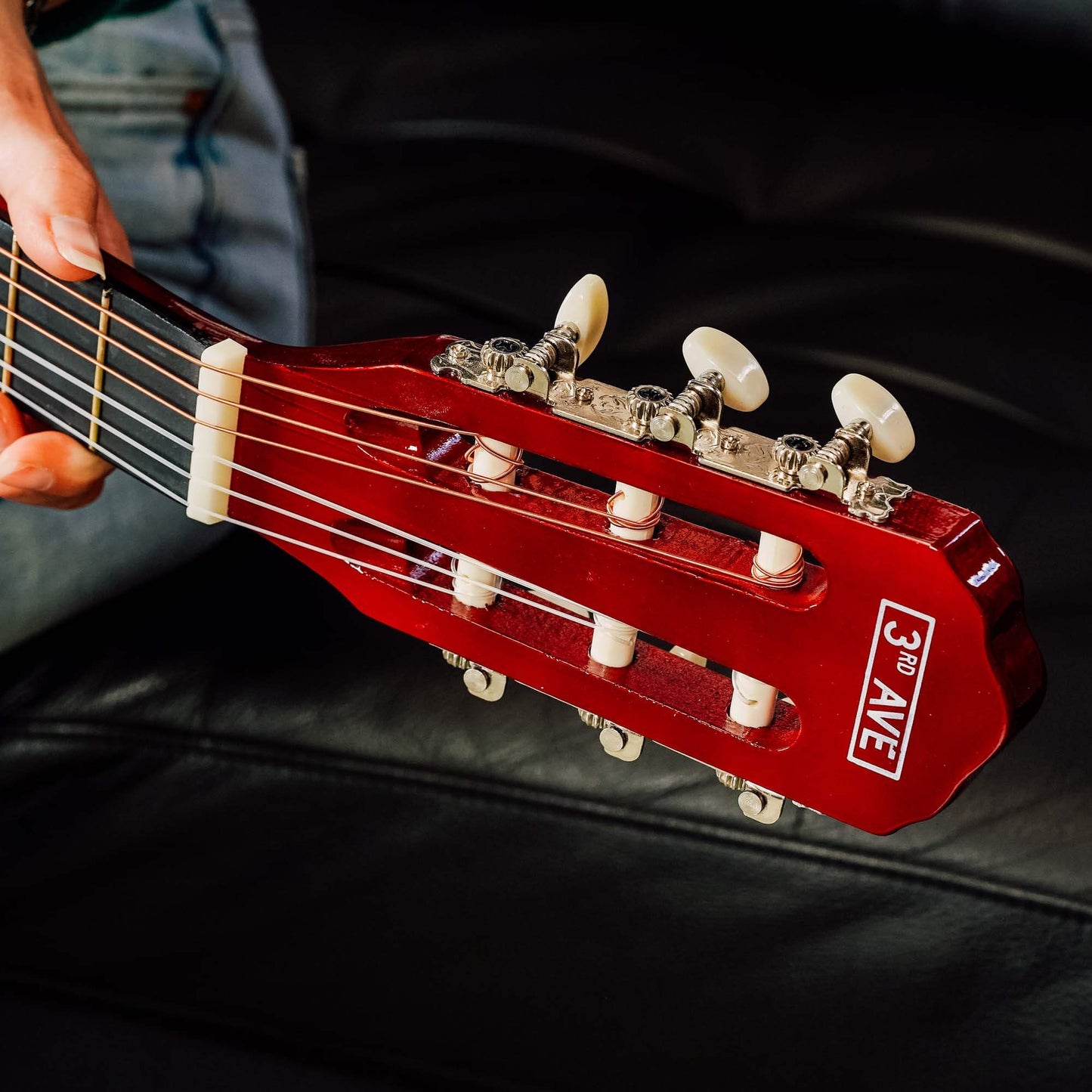 3/4 classical guitar headstock, 3rd Avenue logo, tuning pegs and strings