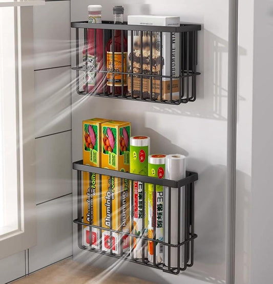 Set of 2 black wire wall storage boxes on the inside of a white cabinet door
