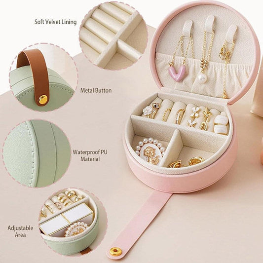 Small jewelry travel case with soft lining and ring slots in open lid
