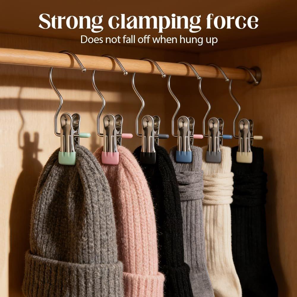 Row of boot hanger clips with clamps holding folded socks on a rod