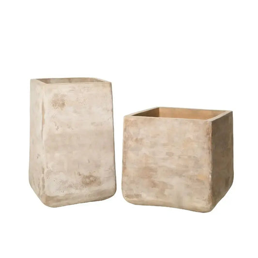 Set of two beige concrete squircle planter pots with open tops