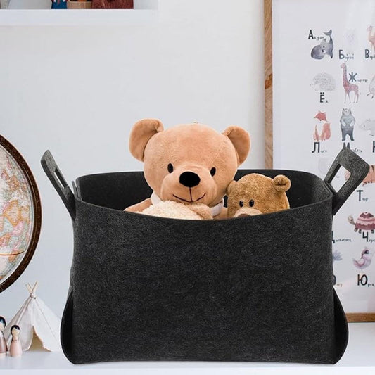 Felt storage basket with two side handles, holding plush toys inside.