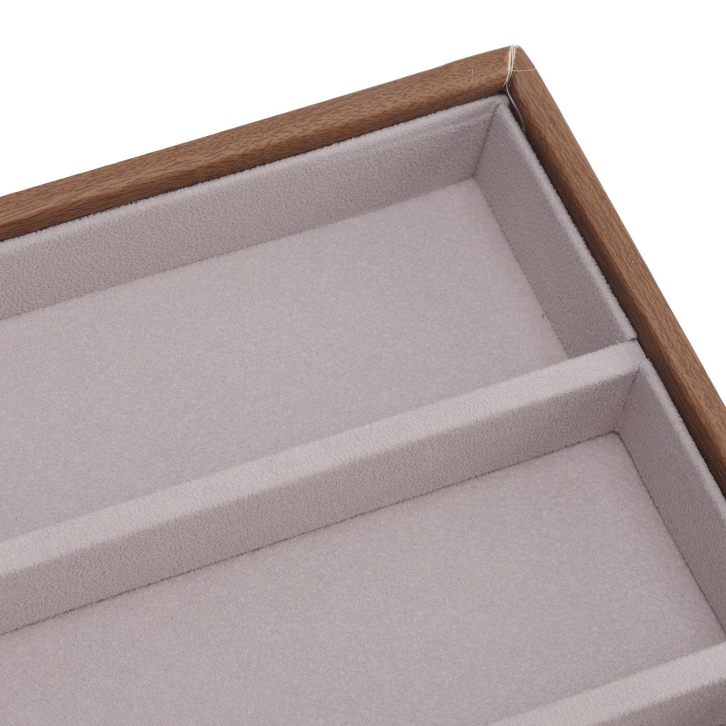 Sunglasses display tray edge with gray padded rows and wood-style outer frame